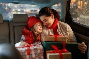 Woman,And,Her,Child,Holding,Presents,And,Delivering,Them,On